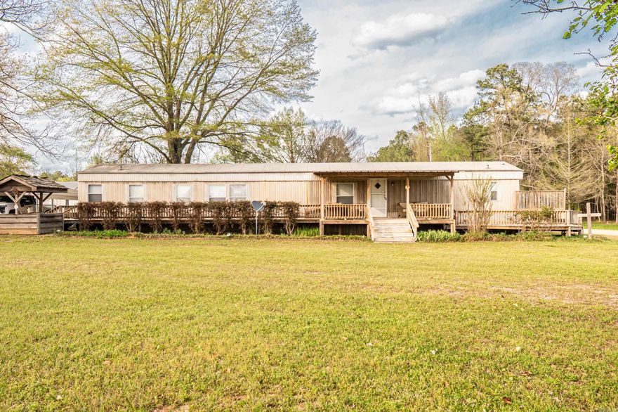 Country Living close to town!! 3 bed/2 bath mobile home on 3 acres. Enjoy peaceful living with plenty of room for a garden, animals, or simply enjoying the outdoors. Spacious wooden decks on front and back. Large 35 x 60 shop for projects and also has a separate 14 x 24 storage building. Comes with a chicken coop and a rabbit cage also. Has new septic lines also