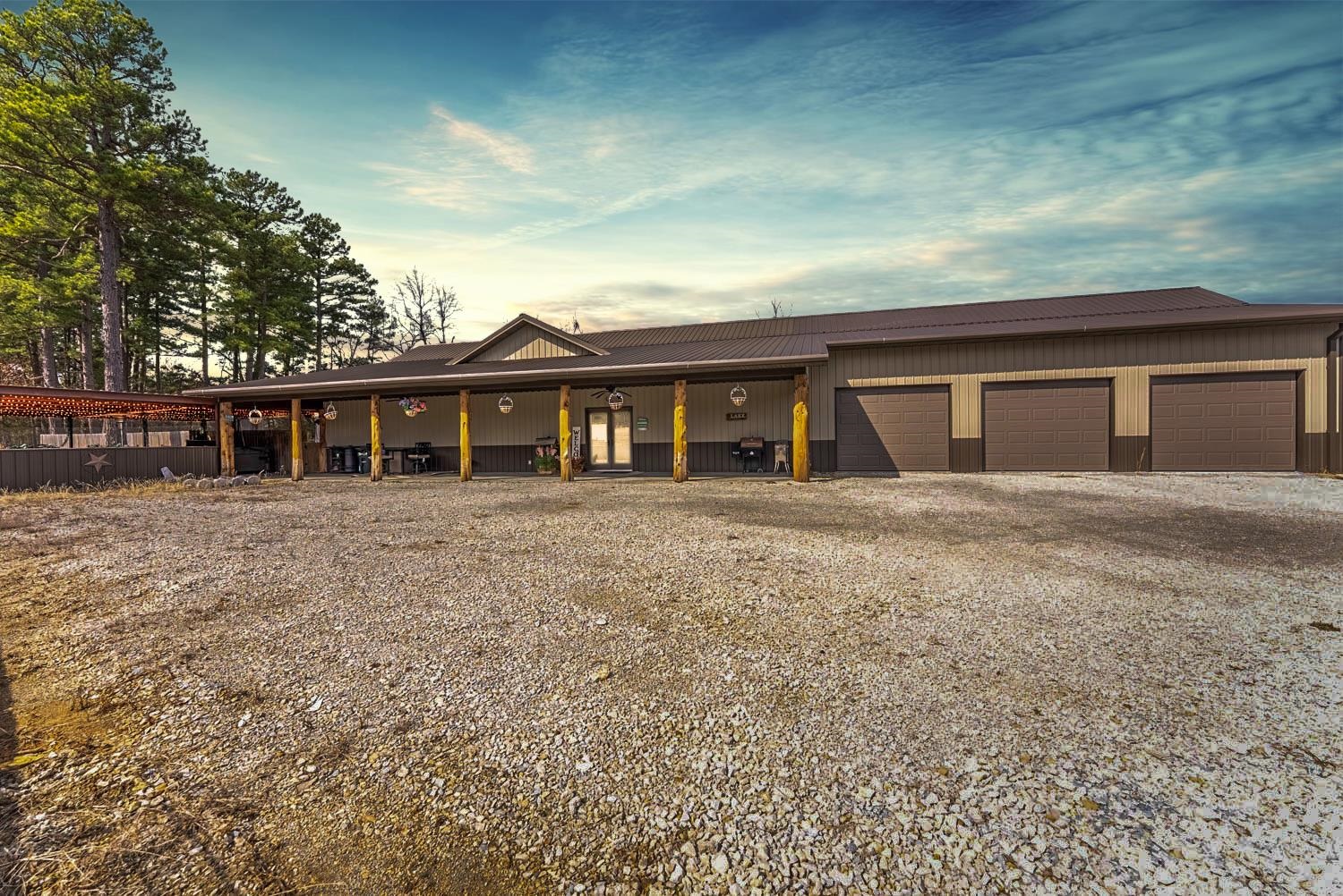 Lakefront Property with Home and Shop on 32 Acres for Sale in Fulton County, Arkansas. This lakefront property in Fulton County, Arkansas features a custom-built 2-bedroom, 2-bath home on 32 acres of wooded land. This open-concept home offers large windows with views of a private stocked lake with crappie, bass, and bluegill. The spacious master suite includes a walk-in closet, exterior access, double vanities, a jetted tub, and a walk-in shower; a true retreat. The 2nd bedroom and additional bath provide space for guests or family. All doors and hallways in the home are extra wide making the home accessible. The 3-car garage includes a concrete storm shelter/safe room. A 40x40 shop with a 15-ft lean-to provides ample storage for equipment, ATVs, or boats. The fenced backyard adds privacy and security for pets. The property is ideal for hunting, fishing, and outdoor recreation, with wooded acreage offering privacy and seclusion. The covered outdoor entertainment area features a bar, stone fireplace, and hot tub. Located just 8 minutes from Lake Norfork access and 15 minutes from Mtn. Home, this Baxter County property provides the perfect combination of lakefront living and acreage
