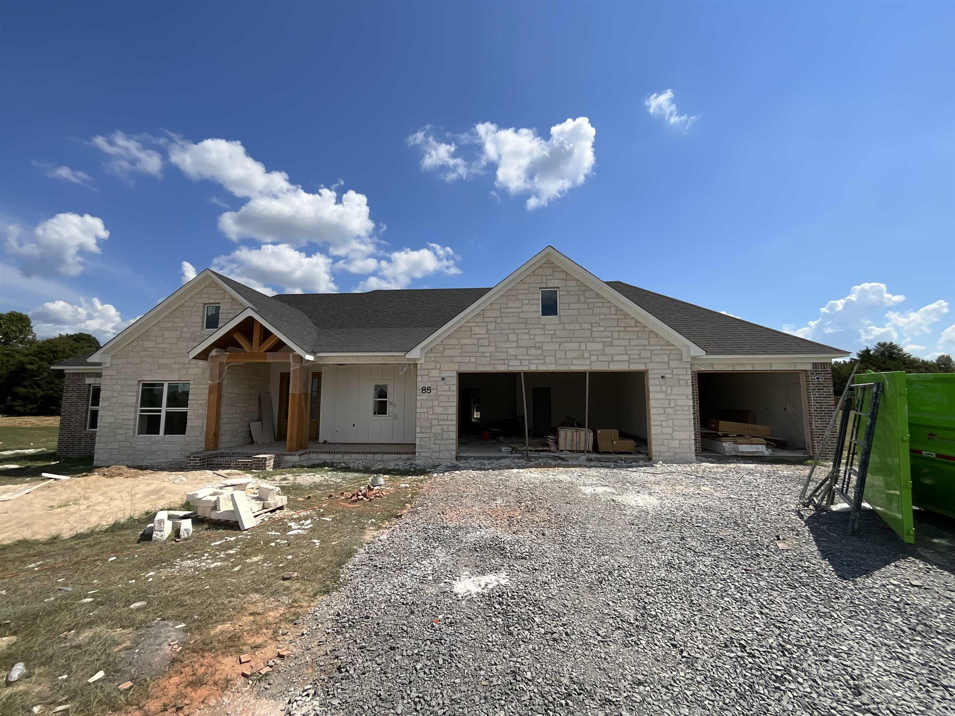 You have a view of the lake from the front porch! This floor plan is perfect. 4th bedroom is at the front of the house and would also make a great office. Vaulted ceiling in the living room with a wood beam. Electric fireplace with brick and shiplap. Kitchen has all the extras, huge hidden pantry, lots of storage with drawers for spices and utensils. Large laundry with a sink and walks through to the master closet. Separate tile shower with soaking tub. 3rd full bath as you enter from the garage. No carpet. Jack and Jill bathrooms between the spare bedrooms with a door to the hallway as well. All of this on a .66 acre lot. Don't forget the large back porch with vaulted wood ceiling overlooking the privacy in the backyard. Wood under the front porch ceiling as well. High speed fiber.
