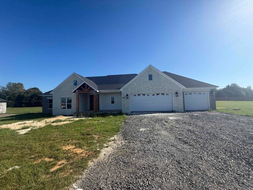 You have a view of the lake from the front porch! This floor plan is perfect. 4th bedroom is at the front of the house and would also make a great office. Vaulted ceiling in the living room with a wood beam. Electric fireplace with brick and shiplap. Kitchen has all the extras, huge hidden pantry, lots of storage with drawers for spices and utensils. Large laundry with a sink and walks through to the master closet. Separate tile shower with soaking tub. 3rd full bath as you enter from the garage. No carpet. Jack and Jill bathrooms between the spare bedrooms with a door to the hallway as well. All of this on a .66 acre lot. Don't forget the large back porch with vaulted wood ceiling overlooking the privacy in the backyard. Wood under the front porch ceiling as well. High speed fiber.