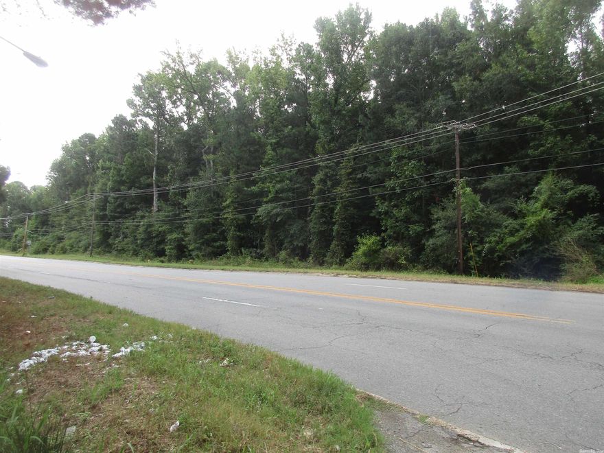 Property is composed of approximately 18.59acres.  Sheridan Road frontage perfect for commericial properties, apartments, etc.  Great timber on this property.   Excellent place for development.  Call today, don't let this hidden gem get away.