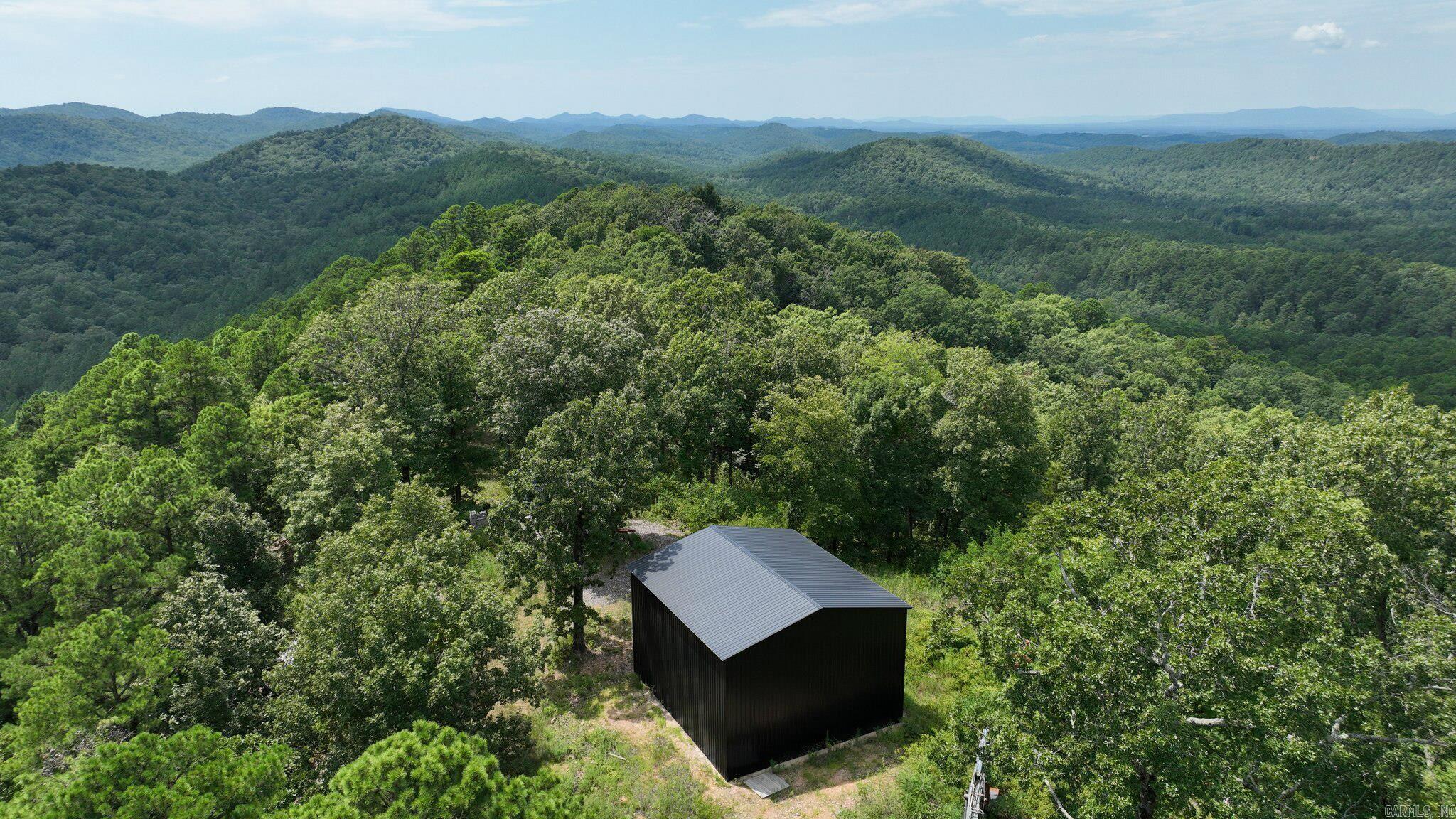 Discover 85.29 acres of natural beauty in the Big Fork area, bordered on three sides by the Ouachita National Forest and offering serene mountain scenery, including vista-style overlooks. Known for its peaceful setting, abundant wildlife, and outdoor recreation, Big Fork is a hidden gem in the Ouachita Mountains. The property already has a well and power on-site (subject to inspections), a good road in place, two outbuildings ready for finishing, and a designated cabin site ready for your vision. Enjoy easy access to the famous Wolf Pen Gap ATV trails, or create your own network of riding and hiking paths right on your land. Rolling hills, higher elevations, and lush wooded terrain make this a haven for deer, turkey, bear, and small game. Whether youāre seeking a private hunting retreat, a recreation destination, or the perfect spot for your dream mountain getaway, this property offers endless possibilitiesāall just a short drive from the small-town charm and amenities of Mena, Arkansas.