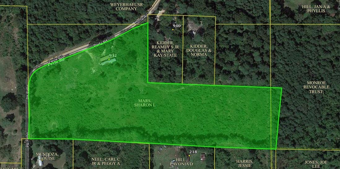 12.19 Acres of nice useable land with timber, pond & pasture. Has dated manufactured home on it. Electric, Septic, City Water, and Well located on the property! Fiber Optic Cable! Seller is Motivated! Make an offer!!