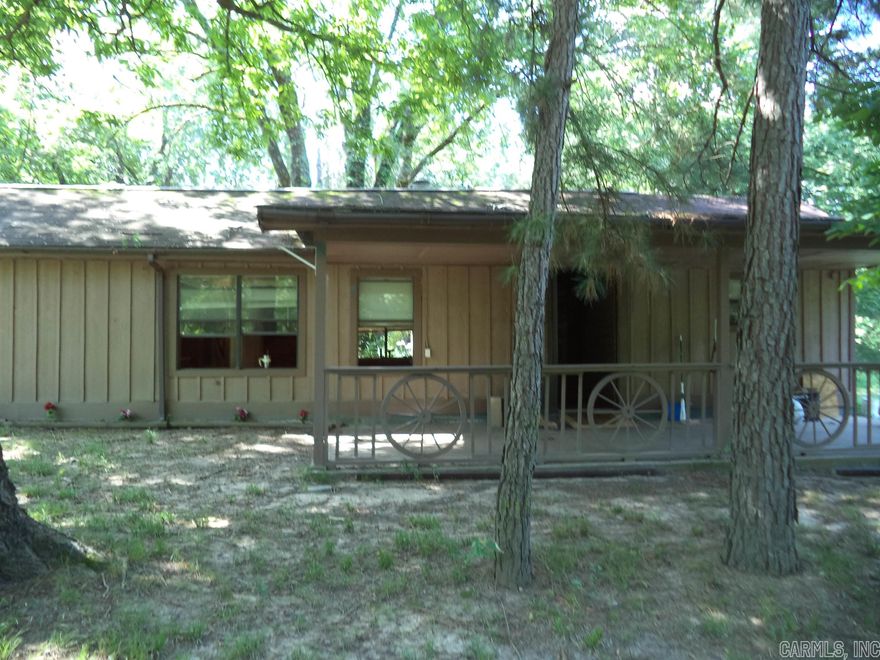 Rustic home close to fishing at Arkansas River.  2 br 1 bath home is 1056 sq. ft and constructed from 8x8 sawn timbers, sheathed with wood siding.  Convenient to I-40. Needs some TLC but a great starter home.