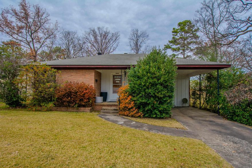 Adorable Mid century modern cottage. This well maintained home sits on a large fenced corner lot. New hardwoods flooring opens to a lovely arch way into dining room with an open floor plan. Lots of light in the original roll out windows. One huge bedroom with corner windows, two closets, a nice berber carpet and a larger second bedroom. A nice large gas stove in the galley kitchen has been used 3 times, the washer/dryer convey off the closet in the kitchen. One car carport, a relaxing front porch and out door storage shed. A french drain on the back of the home with rock landscaping. HVAC is a year old. This home was priced for a quick sale and As Is.