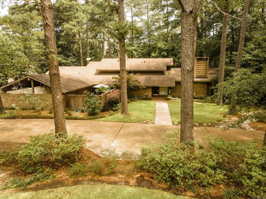 Beautiful five-bedroom four bath home sits in the heart of Magnolia in a quit well-established neighborhood. This two-story home has a lot of character and features. An elegant formal dining room, large formal den with a striking fireplace, and a cozy family room. Windows that display lots of natural lighting throughout the home, master suite with his and hers walk in closets, spacious master bath with granite counter tops and newly tiled shower. Spacious kitchen with lots of cabinets for storage, pantry and large laundry room off the three-bay carport. Big courtyard, pool, and outdoor area for entertaining guests. Home has much to offer!