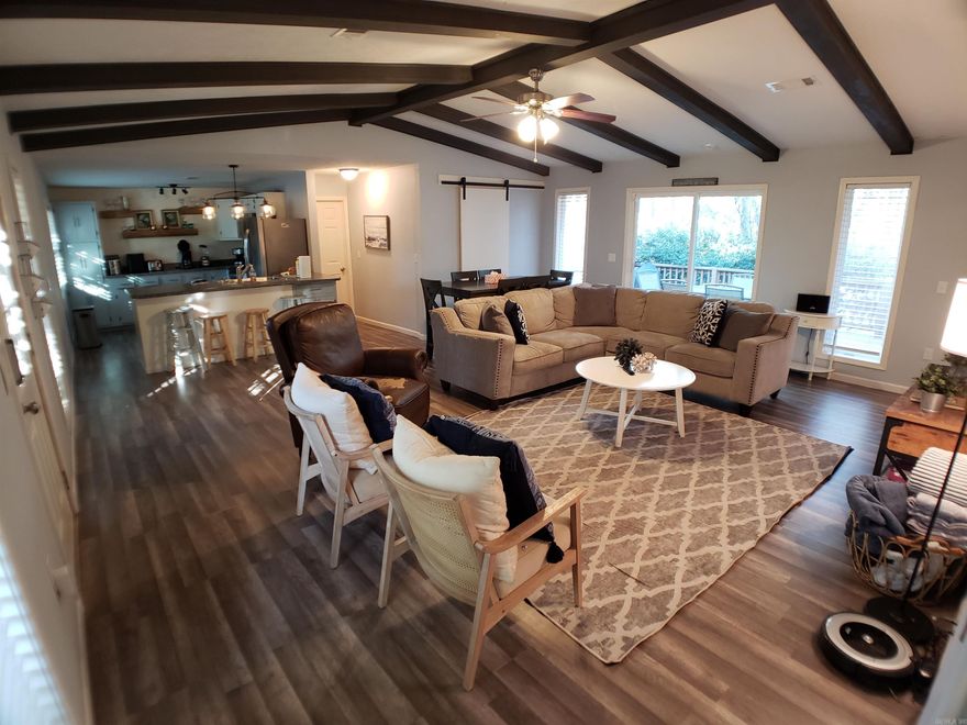 Discover your move in ready retreat at this impeccably maintained home, nestled merely 500 feet from the entrance to Fairfield Bay Marina. Beautifully updated, fully furnished and ready for immediate enjoyment, this residence promises an ideal getaway for relaxing lake weeks with family or serves as a charming permanent abode. The spacious living area and open kitchen create a welcoming environment, perfect for gathering after days spent on the water. For those preferring the tranquility of home, the deck and serene, wooded backyard provide a peaceful haven. Embrace the full suite of Fairfield Bay amenities, partake in vibrant local festivals, and create cherished memories that will endure through the years. With spring finally arriving, now is the perfect time to schedule your visit and see all that this delightful home has to offer! AGENTS SEE REMARKS