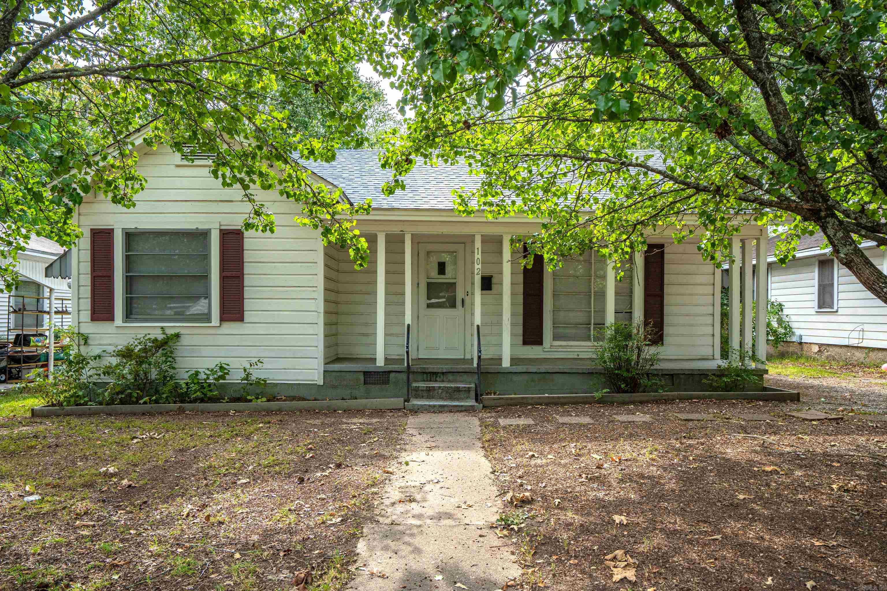 PRICE REDUCTION!! Come take a look at this charming bungalow, centrally located featuring two bedrooms, 1 bath with original hardwood flooring and new LVP flooring in the kitchen. Enjoy the covered front porch and private large backyard in a quiet neighborhood. Great rental history for investors!