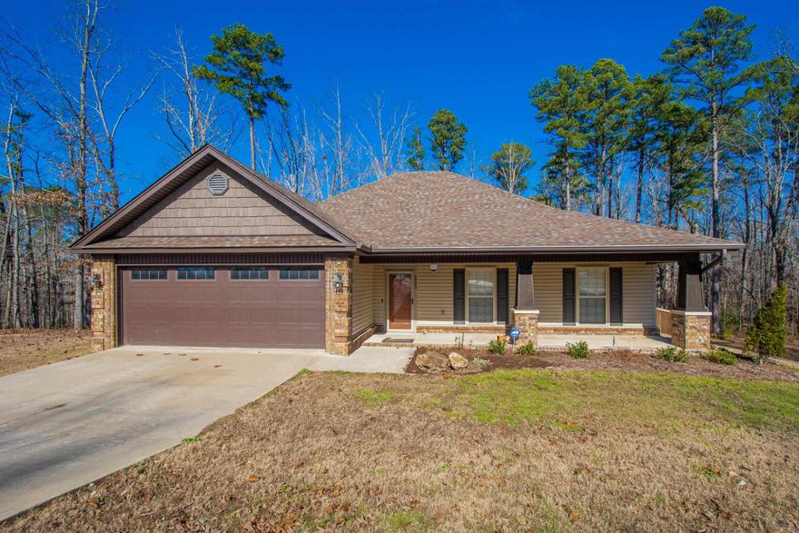 Craftsman style home with oversized front porch. 1 acre corner lot fully fenced. Backyard is partially wooded adding just the right amount of privacy while relaxing in the screened back patio. Concrete landing extension for grilling. Open floorplan, split master bedroom plan, corner brick wood-burning fireplace, granite counters. Updates: interior paint, light fixtures, laundry room cabinets & folding racks, kitchen backsplash & dishwasher, tile flooring in both bathrooms, & whirlpool tub surround tile.