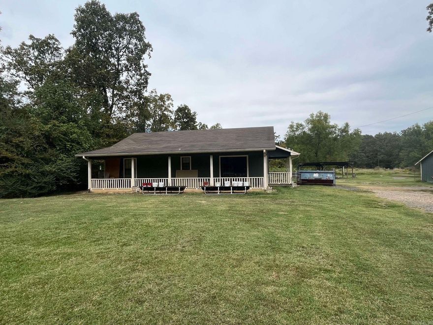 Tons of potential! 2B/2B on 7 acres. 1400 Sq ft. Outside city limits. Property just needs some fresh energy to bring it back to life. 2 mini barns, carport, small pond. As-Is! Hurry before it's gone!