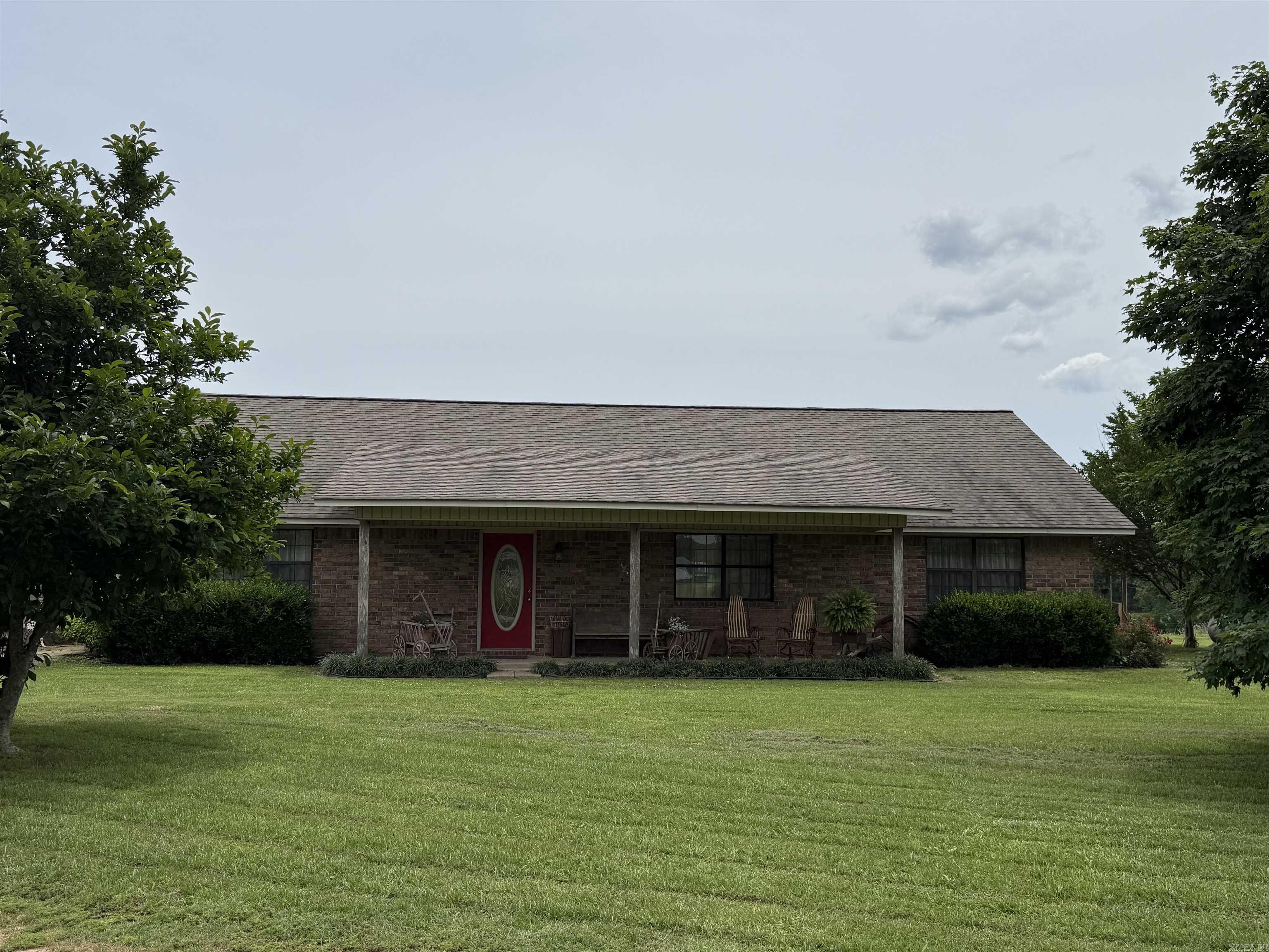 Poultry operation located in McCaskill, offers (2) 43x500 poultry houses, built in 2020 situated on approx 76 acres, includes a 1,764 sq ft brick home built in 2000 with 3 bedrooms and 2 full baths. Home is move in ready, offering an open concept living/dining and kitchen with cathedral ceiling. Kitchen offers lots of cabinet space, breakfast nook, new large country sink, refrigerator, stove and dishwasher. Large laundry room with access to detached two car-port with covered patio. 18x36 in ground chlorinated pool, She-shed with electricity, propane operated house back-up generator, high speed fiber internet and storm cellar. 18x32 kitchen style entertaining patio, metal equipment shed and 30x30 shop building. Property is fenced and crossed fenced for cattle, Large 2 acre pond with 3 additional ponds, nice hay meadow, 2 poultry houses and generator. This property is well maintained and ready for a new owner. Contact our office for more details or to schedule a showing.