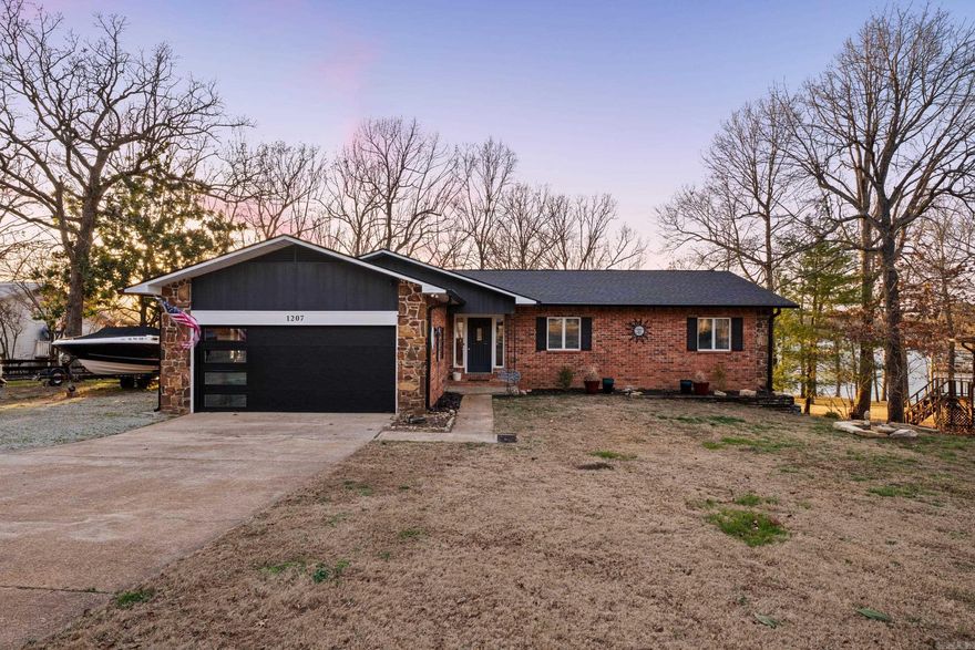 Enjoy lake living in this 4-bedroom, 3-bath home sits on a large, park-like property of almost 3/4 acre along Crown Lake in Horseshoe Bend. The main living area features a cozy gas fireplace and large windows that bring in natural light and scenic lake views. The updated kitchen offers modern finishes and plenty of workspace for everyday living or entertaining. The walkout basement provides additional living space and is perfect for hosting, complete with a bar and room for a game or media area. Step outside to relax year-round on the screened-in porch or enjoy the lower patio overlooking the water. This property also includes a heated and cooled workshop and a spacious 14x20 shed, offering excellent space for hobbies, storage, or lake equipment. With room to spread out and easy access to all the recreation Crown Lake has to offer, this low maintenance home works well as a full-time residence, weekend retreat, or vacation getaway. Don't miss this opportunity to relax and take in the breathtaking sunsets over Crown Lake! Create your own memories while enjoying lake life at it's best!