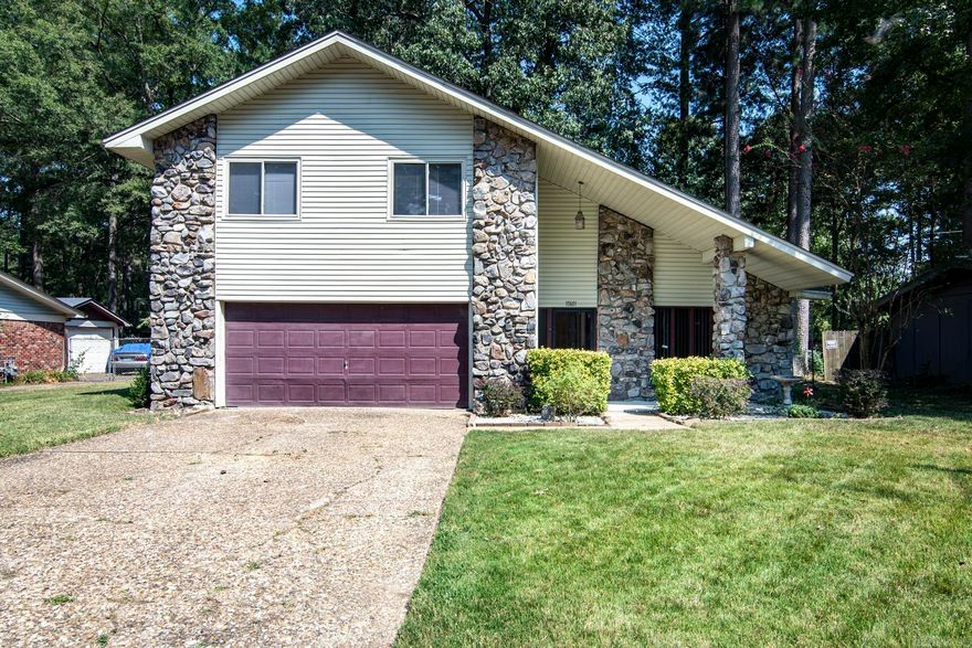 This well-maintained home sits on a large level, tree shaded lot.  The spacious great room has a vaulted, beamed ceiling, lovely stone fireplace, built in bookcases, and bar for easy entertaining.  The kitchen has granite counters, stainless gas stove, dishwasher, and built-in microwave, and is adjacent to a generous dining space that could also be a second living area.  Two storage buildings in the back are ideal for storage or workshop.  Fenced yard.  Trampoline and back yard swing to convey.