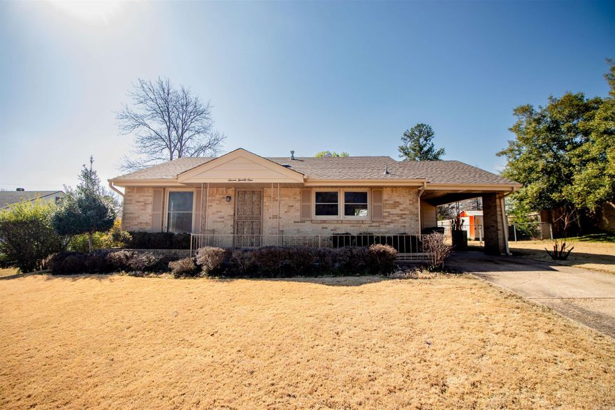 Just completed remodel!  New paint, new flooring in kitchen, new gas range, dishwasher, combination washer/dryer. Big picture window in living area that lets in lots of natural light. Three bedrooms, one and a half baths, single car carport, vinyl windows, small storage building, huge fenced in backyard.   Super clean and super cute with great curb appeal!