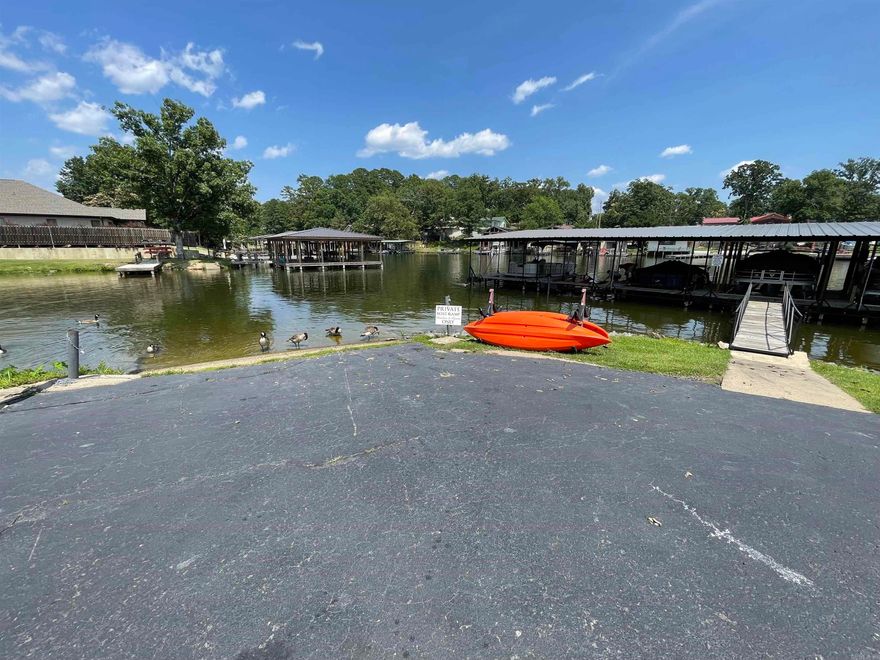 2 boat ramps for easy launching, convenient location minutes away from groceries, restaurants, movie theaters, pickle ball, Hot Springs Health and Fitness, Of Course Oaklawn Thoroughbred Race Track and Casino, David's Burgers, Chick-fil-A, Lowe's, Sam's Club, Title Company, Banks, Whataburger, Starbucks, etc. Wonderful Swimming Pool, You could Swim to Sam's Pizza! Appliances Convey - including Clothes Washer and Dryer. New Roof 2024 Minutes away from ER and Hospital.  You can eat at the Hospital, but across the street Sam's Club has a hot dog and drink for $1.55 including tax. Easy to see - call your favorite realtor or your friendly listing agent - me! NEW ROOF 2024   *** NEW AC 2023