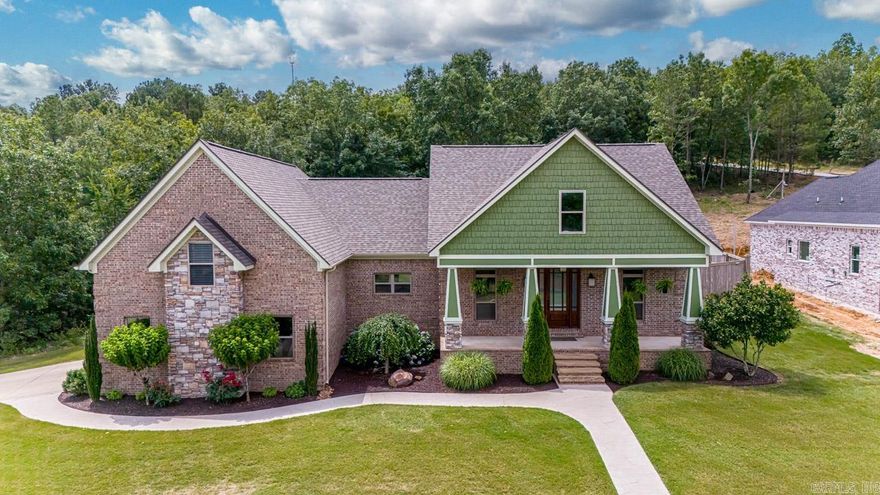 Exquisite home in a gated lakeside community with a chef’s kitchen, high-end Thermador gas range, & expansive island. Open living space features beamed ceilings & a stone fireplace. The primary suite boasts a large closet, walk-in shower, & soaker tub. Upstairs, a flex space includes a walk-in closet & bath. Complete with a heated & cooled shop in the spacious backyard with 220V electric-a perfect sanctuary of luxury & convenience along with an additional exterior fireplace!