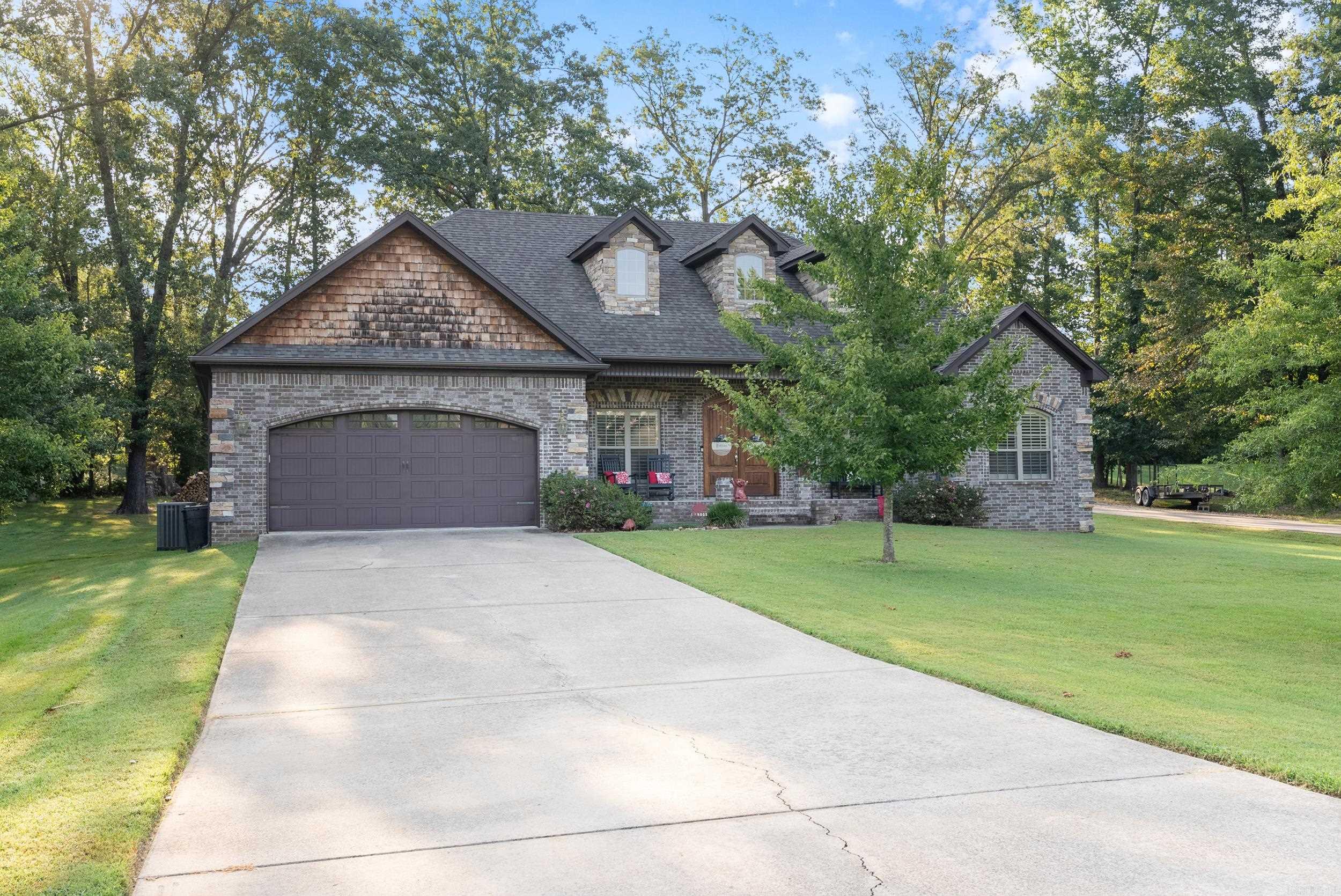 Discover your dream home nestled in the serene, family-friendly Confederate Woods neighborhood of Cabot, AR. This charming residence offers a perfect blend of modern comfort & rural tranquility on a spacious lot. The home boasts a huge 29' X 23.5' kitchen/dining area w/ 2 sinks, gas range w/ oven, plus a wall oven & microwave & cabinets galore. The laundry room has a built-in sink & room for a refrigerator & freezer & features a convenient half bathroom. Enjoy cozy evenings in the inviting living area, with gas fireplace. Three large bedrooms share 2 full baths & the master suite has a jetted tub, walk-in shower w/ double vanities & 2 closets, all wet areas have tile floors & granite counters. A 28ā X 23ā patio faces East & is sheltered from cool north winds & hot afternoon sun, it overlooks the fenced backyard where your pets can roam safely with room to play or grow a garden. The main garage is over 23 ft long & 25 ft wide, room for your truck & full sized SUV. A separate 200' concrete driveway leads to the detached shop, w/ 420ā of living space w/ full bath, above the 30'X24' garage, both are climate controlled. New dishwasher & disposal, July 25, new roof & HVAC in 2022.