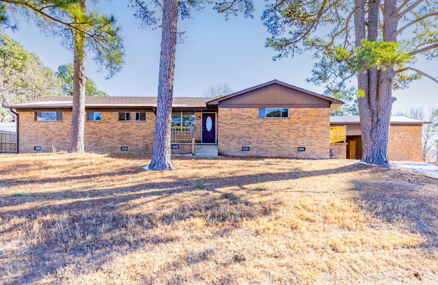 Full remodel on this spacious all-brick home that sits directly across from the lake. Has 4 Bedrooms or 3 Bedrooms + Office (all have closets) & 3 full Baths, with a perfect open concept! This home features all new LVP & tile flooring, new paint throughout, new baseboards, new gutters, new venting under house, new wood railing on front, side & back patios, new interior doors, new lighting fixtures, & new sliding door to backyard. The kitchen is open to the dining & living rooms & has all new granite countertops, cabinets, farmhouse sink, large new window overlooking backyard, walk-in pantry, gas range & breakfast bar. All bathrooms have been renovated with new tile, new vanities, mirrors, & toilets. The huge living room has 2 gorgeous windows overlooking the backyard with a gas fireplace in the center. The majority of the electrical & plumbing have been redone as well. There is a large Shop alongside the carport, that can be used for a number of things. This home also sits on 2 Lots. Roof & HVAC - replaced in 2019. This is not a quick flip...Lots of time & love has been put into this renovation, hoping to make it your perfect home!