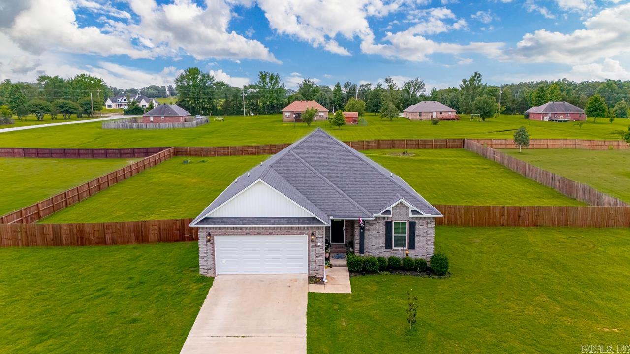 Lovely open concept home within Bianca Meadows Subdivision. These big lots offer a bit of privacy, while maintaining a neighborly feeling. The spacious & open living/dining/kitchen area is the heart of this home. Kitchen features a large pantry, extra broom closet, quartz counters on surrounds, and a butcher-block island. Large primary suite is big enough for a sitting area, and it features dual sinks, large tub, water closet, separate shower, walk-in closet and a large bonus storage closet. Three bedrooms, two bathrooms. Both bathrooms also have quartz counters. Extra floored space in the attic. LOTS of storage throughout! Fully fenced back yard, with covered rear patio is great for kids, pets or entertaining. This gorgeous home sits on almost an acre. Country living only minutes to the interstate and town. Agents, PLEASE read remarks!