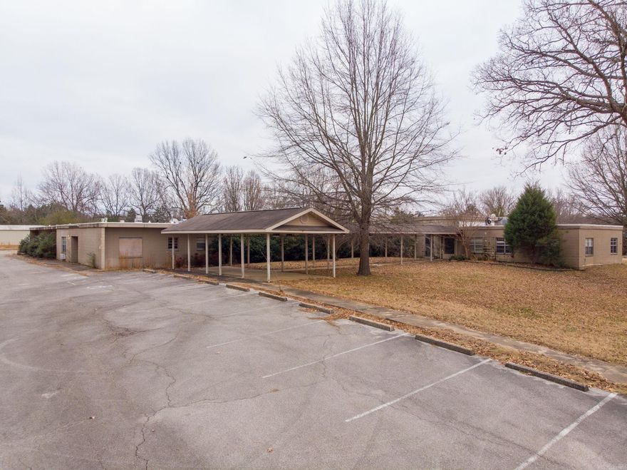 Great location with many possibilties this commerical property sits on 5acres. This property was once a nursing home, could be coverted back into one or a developer can make beauitful homes that back up to the water. So many possibilites, call today for more information.