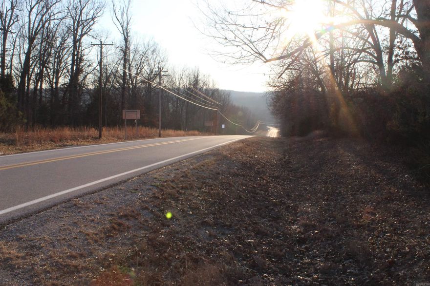 Welcome to this beautiful property containing 18.82 +/- acres  located within the city limits of Horseshoe Bend, AR, offering the perfect combination of convenience to area amenities for all your supplies and natural beauty to explore and enjoy. Situated just minutes from Crown Lake and the Strawberry River, you'll enjoy easy access to numerous outdoor activities such as fishing, boating, watersports and hiking.   With electric already on the property and highway frontage, this land offers ease of access Making it a prime location for building your forever home. The property is nestled in the Ozarks, featuring mature hardwoods scattered throughout, creating a private and serene atmosphere. Whether you're looking for a peaceful retreat or a place to create your dream home, this wooded property is a rare find with endless potential.  More acreage is available for purchase.  Don't miss your chance to own this stunning piece of land in one of the most desirable locations in the Ozarks!