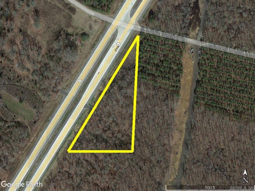 Great commercial opportunity. Hwy 64 Bypass in Vilonia, AR. Property has approximately 750' of Hwy 64 Bypass road frontage and borders Stanley Rd as well. This would be a great location for a business. All useable land with a driveway already accessible from Hwy 64 Bypass.
