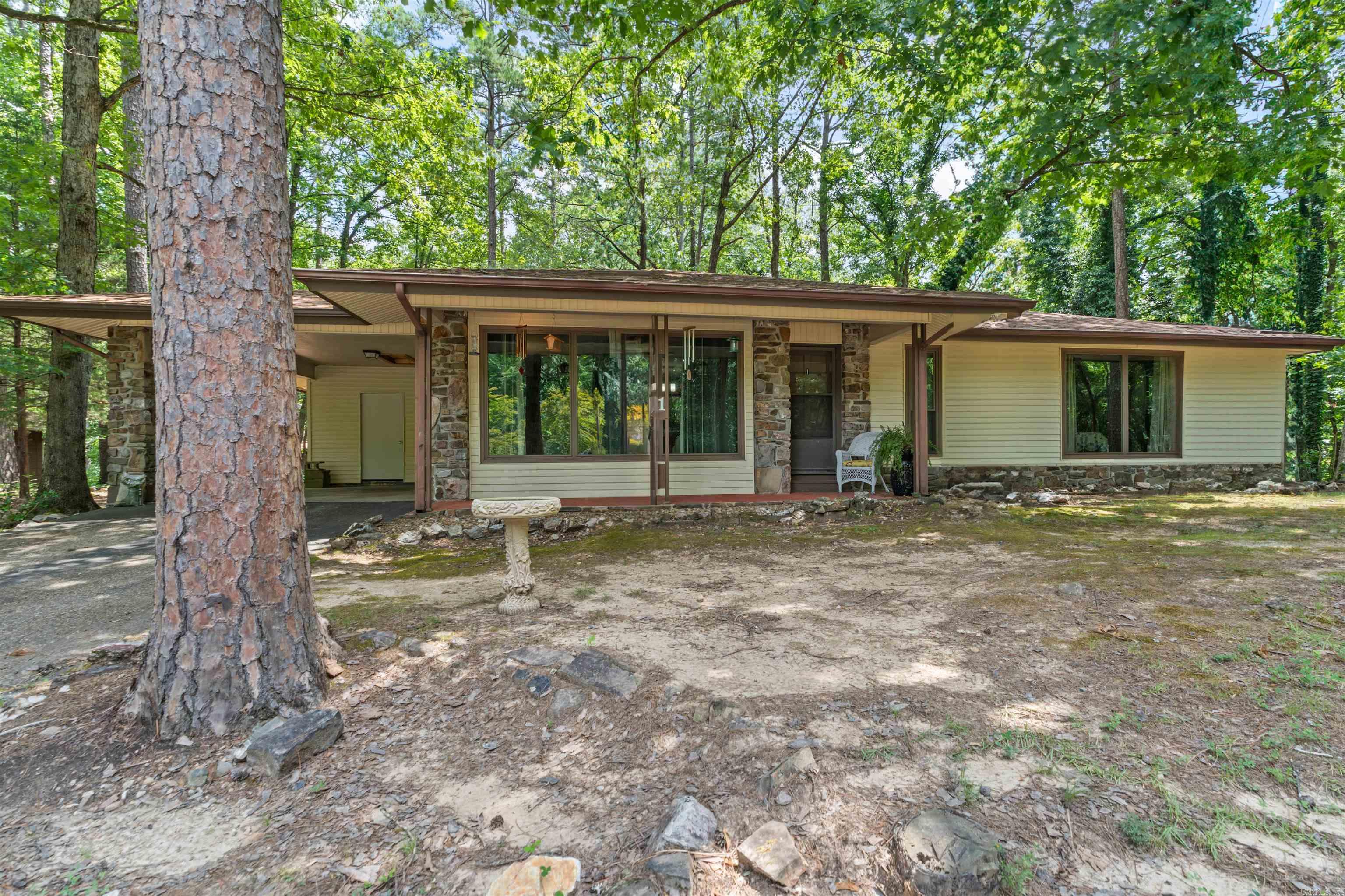 Discover this inviting home on the desirable West side of Hot Springs Village! Tucked on a spacious corner lot, this property blends modern updates with cozy charm. Among the key Features are ALL newer windows (2024)! Stylish stainless-steel appliances in the kitchen updated in 2024. Updated baths! Newly installed LVP and vapor barrier 2024. Open floor plan with a generously sized family room/den and a classic wood-burning fireplace. Handy inside oversized storage roomāperfect for extra refrigerator, freezer or the pantry that you've always dreamed of having! (measures 19' x 5'3") Fenced backyard ideal for pets, play, or gardening. Time to embrace the Village lifestyle! This home offers both function and warmth. Come see it before itās goneāyour future starts here.