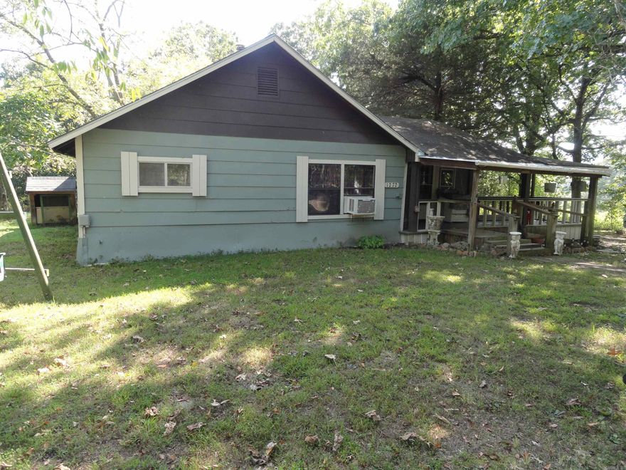 Charming 2-Bed, 1-Bath Home in the Heart of the Ozarks Nestled on a peaceful 1-acre parcel in the rolling hills of the Ozark Mountains, this cozy, older home offers the perfect blend of country living and charm. Located outside of Marshall, AR, in Searcy County, this property is ideal for nature lovers & those seeking a tranquil retreat while still being close to outdoor adventures. Enjoy the warmth of some original wooden flooring, carpeted areas, & ceramic tile in the bath. The home’s vintage appeal shines through with low ceilings adding to the cozy atmosphere. The kitchen features an old-style porcelain farm sink/counter combo, perfect for those who appreciates the nostalgic charm of country living. Stay warm with the wood stove & cool off with 2 window units & a whole house generator for power outages. Large level yard offers plenty of room to re-open the old garden area     & additional storage buildings. Set in the scenic, nature-filled landscape of North Arkansas, this area is a haven for wildlife, hiking, fishing, and countless outdoor activities. This property is perfect for anyone looking for a peaceful escape. See how country life can be both practical & picturesque!