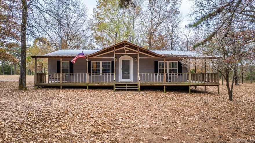 Privacy, wildlife, pond with a fishing dock, 40 acres, and a 50x100 Red Iron heated and cooled shop with kitchen are aspects of this property you do not want to miss!  Nestled just off the road, you will find a well kept mobile home on a permanent foundation complete with a wrap around porch and covered carport as well as vapor barriered crawl space. On the interior, you are met with a large living room just off the kitchen and dining space as well as the split 3 bedrooms and duel bathrooms.  From the side entry of the home, you step into the laundry/mud room with entry into the kitchen space.  Even better news, with an acceptable offer, the refrigerator, washer, and dryer are able to stay with the property.  By the shop you will find a storm cellar as well as a propane tank used for the shop heat.  In addition to having public water, there is a well on the property.  Properties like this do not come along that often, so schedule your showing today!