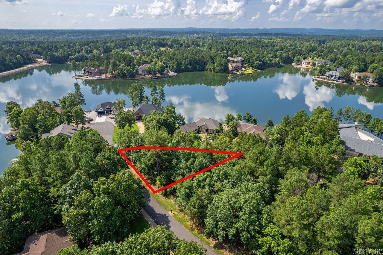 Build your dream home on this beautiful wooded lot with a seasonal view of Lake Granada! Located on a quiet cul-de-sac just minutes from Granada Golf Course, this property offers privacy, natural beauty, and easy access to Hot Springs Village’s world-class amenities. Gentle slope may accommodate various home designs. Enjoy the peace and serenity of lake living with nearby walking trails, a boat ramp, and picnic areas. One of the few lake view lots still available—don’t miss it! Lot 20 and 22 are both available—buy one or both for added privacy!