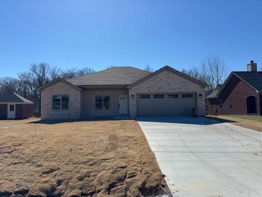 You absolutely will not find a more quiet spot with a brand new home! This home is now occupying one of the only lots left in the popular Wilhelmina Cove. The house backs up to a quiet creek where you will have the privacy behind you and the peacefulness that comes with it. Located at the end of a cul de sac for another bonus. This home will have LVP flooring throughout. Stained maple cabinets with beautiful granite tops in kitchen and bathrooms. A nice patio will be added under the covered porch. Gutters will be added as well. You won't want to miss out on this one!