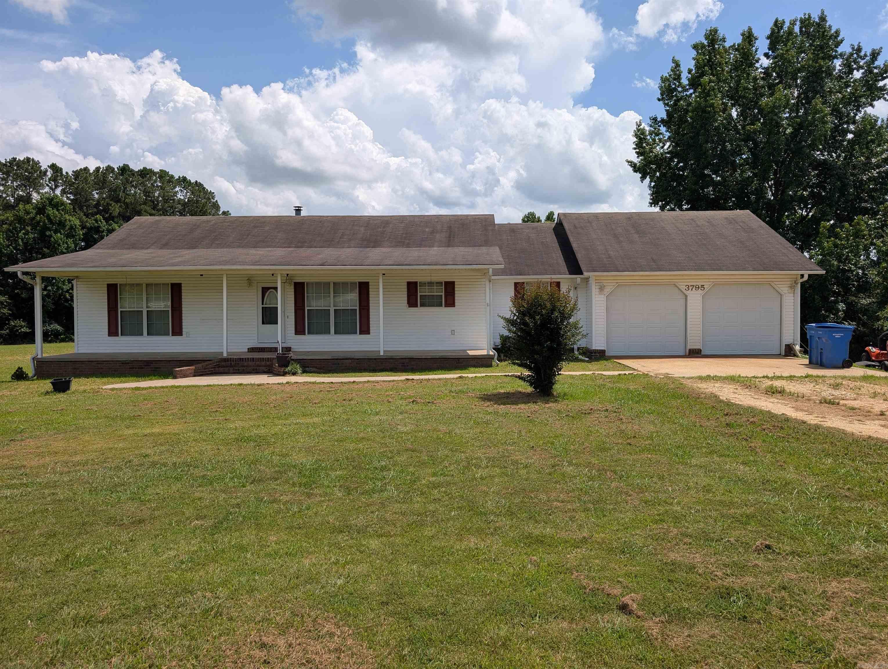 Large open lot and spacious home! This property is just minutes from Paragould, with many recent updates including a new back porch, garage doors, and storm doors. It has 3 bedrooms on the main living floor and 3 bedrooms downstairs, one of which has a safe room. Both down and upstairs have a fireplace. Option to purchase additional acreage with the purchase of this home.