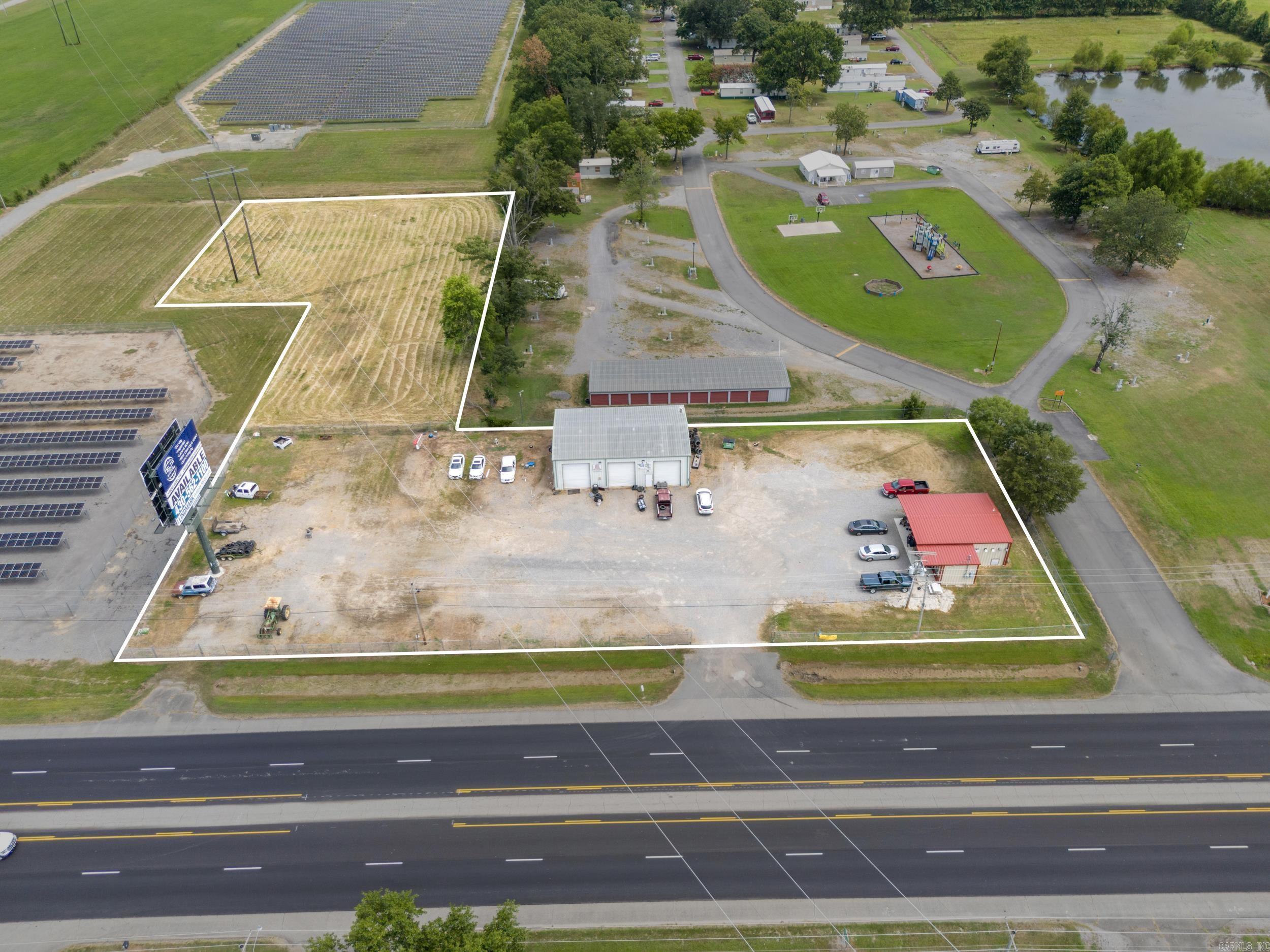 An exceptional business opportunity is in store for you! This combined property offers a total of 3,300 square feet. The 2,100 square foot mechanic shop as well as a 1,200 square foot laundromat sits in the heart of Bald Knob. Although these contiguous properties have the option to be separated, why forfeit the opportunity of passive income from the laundromat? The laundromat has only been open for 2 years; in addition, top of the line equipment and a professional dog wash are included. The laundromat, built in 2023 and sitting on approximately 1 acre, is available for $375,000. Built in 2002, the mechanic shop includes 2 car lifts that are approximately 3 years old; furthermore, a billboard placed on the property guarantees a monthly $135 check from the billboard owner. The mechanic shop, sitting on approximately 2 acres, is available for $275,000. This entire property includes 350 feet of exceedingly visible highway frontage on highway 167; thus, your potential business will demand attention from approximately 15,000 onlookers daily. Do not forfeit this spectacular opportunity.