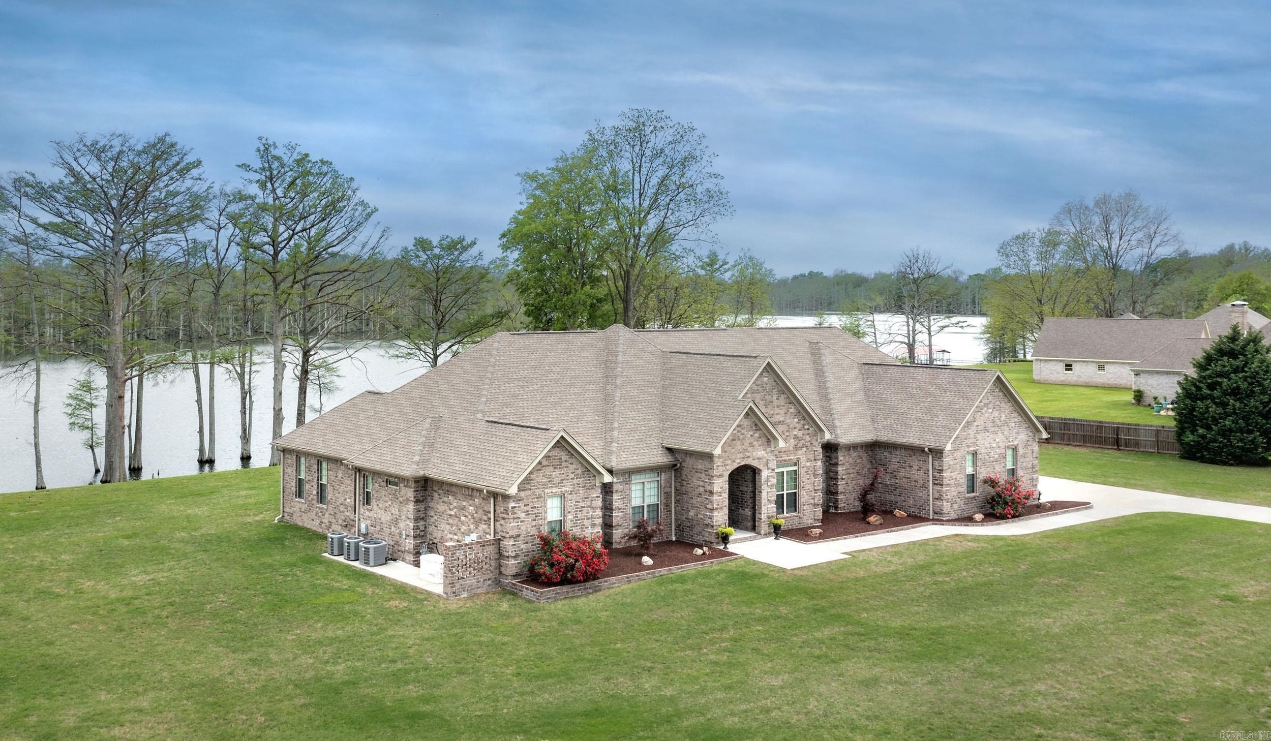 This Beautiful Lake View property is a must see. Sitting on 2.11 spacious acres this home is designed for entertaining. Double Islands, pot filler, oversized pantry, oversized laundry rm, game room, Sunroom, safe room, valuables room, fitness room, beauty salon, outdoor covered hot tub, Generac generator, detached shop with half bath, gazebo, surround sound in the home & shop, com room with monitors and camera's, 3 car garage with epoxy flooring and so much more. Appointment Only with pre-approval letter requested by seller.