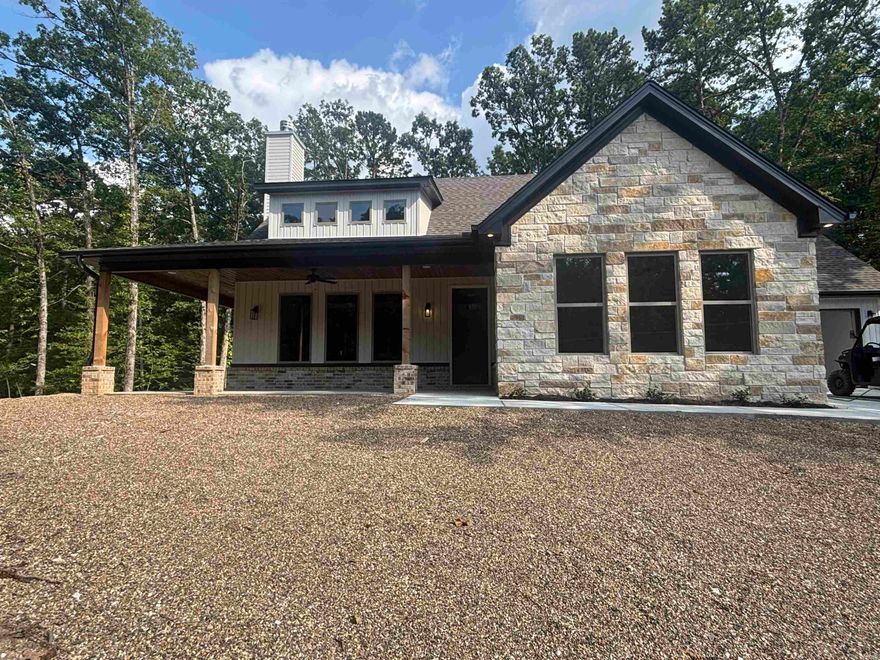 Privacy at Mt Harbor Resort on  Lake Ouachita. 1.00 acre lot in Harbor South with plenty of privacy. surrounded in the back with national forrest!. This home has 2325 sq ft 4 bed and 3 full baths . Plenty now room for family and friends. Walk around porch to enjoy those evenings at the lake. swimming pool , tennis ct , park for all guest. If you are looking for relaxation and have the forrest behind you , then this is it.