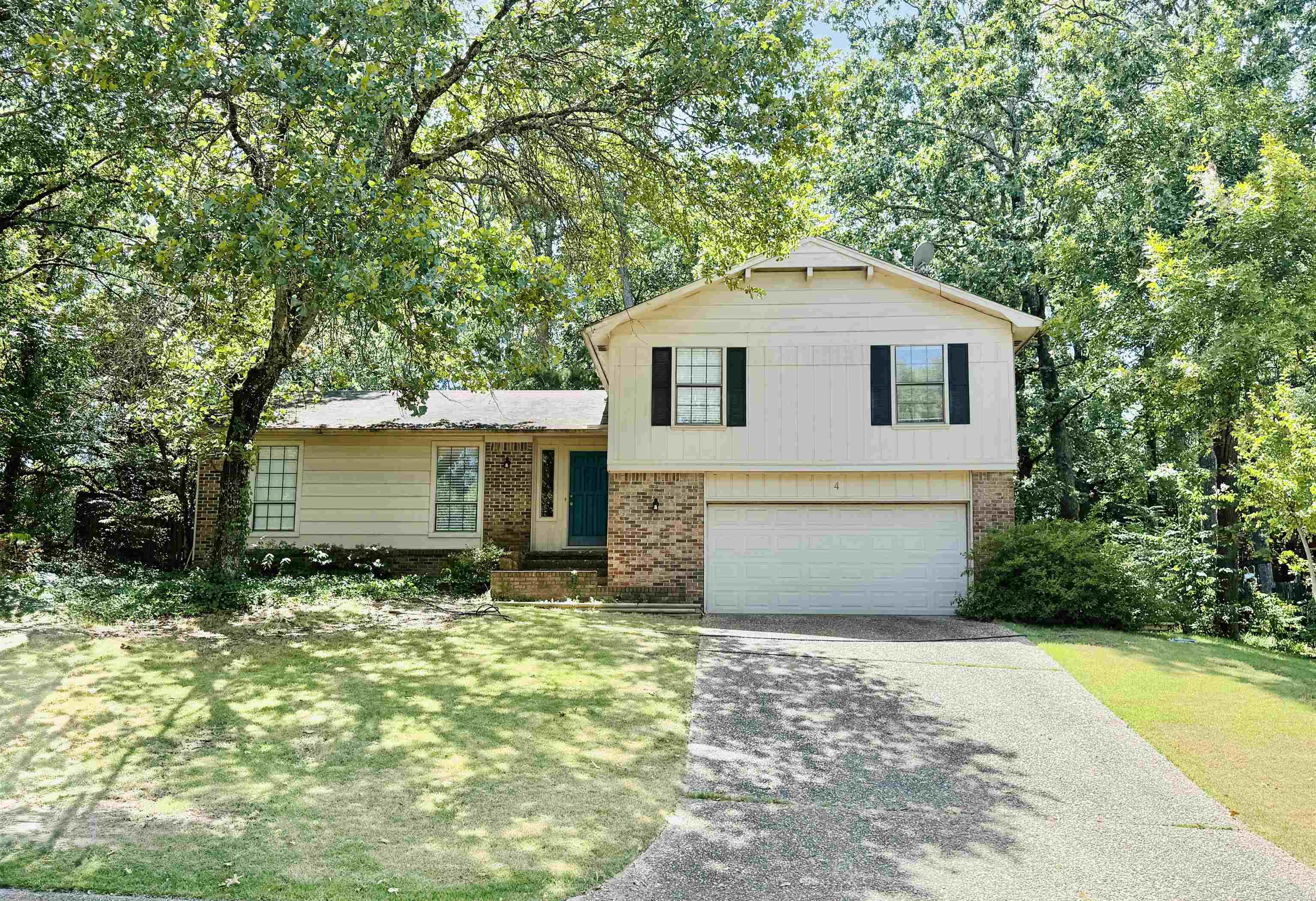 This very nice home is being sold As-Is with 3 br's upstairs and one br downstairs. The living area is large and inviting and looks out onto a brand new deck in a fairly private wooded setting. This neighborhood is bordered by Pleasant Valley and Colony West and has very quick access to Cantrell Road and the I-430 corridor.