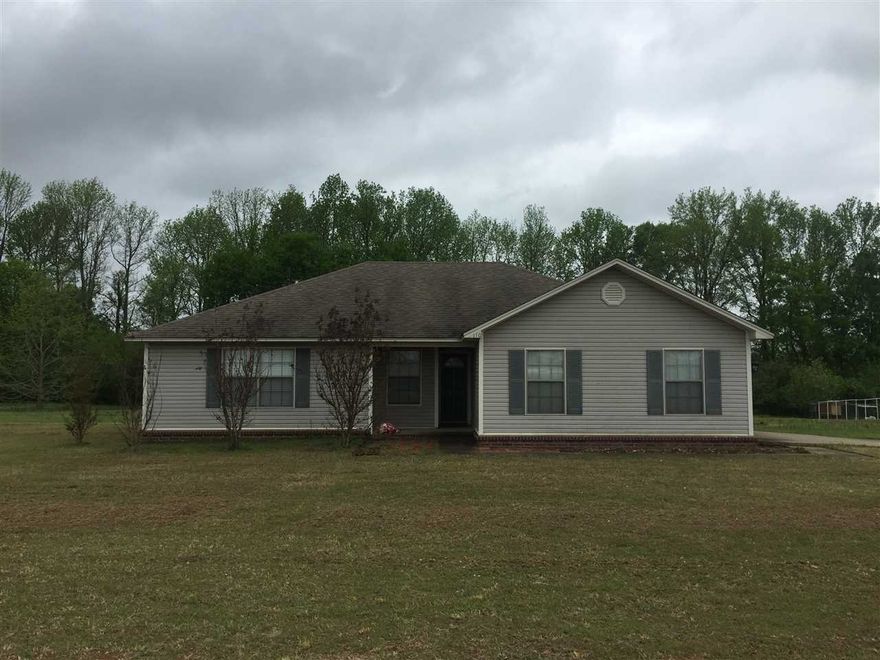 Great location in the county while still in a neighborhood and right off a main hwy for easy commute and shopping.  The home has been well maintained and includes a wood burning fire place, vaulted ceilings, and split floor plan. The backyard has a nice deck and an acre of cleared level land to enjoy. Home is all electric.