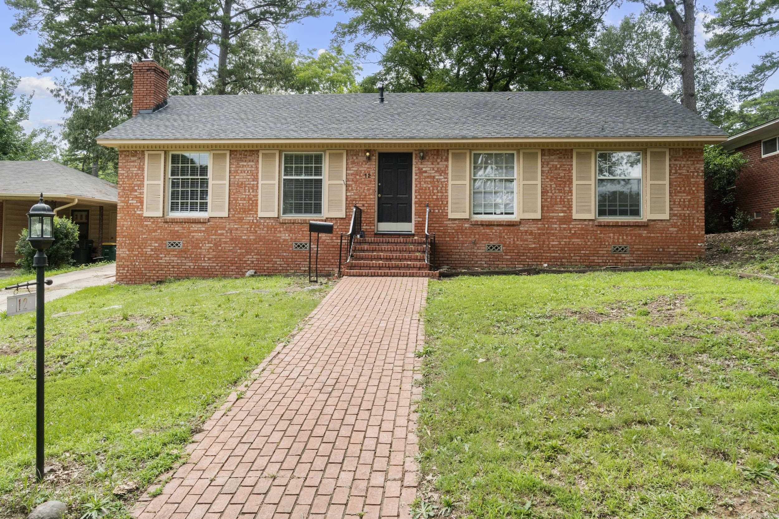 This 3BR/2BA newly renovated home is ready for you to see! It boasts a lovely mix of original charm and modern updates. With a NEW roof, at that! The kitchen features new granite and a gas stove, with a new refrigerator to convey. New paint & new bathrooms! Take a seat by the fireplace and admire the gorgeous original painted tiles. With a carport in the back and lush greenspace behind you, you aren't staring out the back window straight into your neighbors. Or you can use that space for a lovely patio setup for entertaining. 7 min to Target & UAMS, 10 minutes to Kroger, and 2 minutes from UALR! This is conveniently located, wonderfully maintained and updated, and in a growing area. Schedule your showing today!