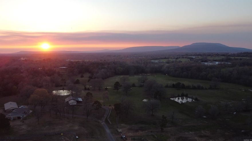 Back on the market through no fault of the sellers, this working 80-acre ranch holds appeal for those dedicated to hunting, ranching, cattle, and horse activities with stunning views of Mt Nebo. This working ranch and cattle facilities includes three corrals, a drive-through barn, a five stall barn complete with tack room just to name a few!  Overlooking the ranch are huge bay windows in the master bedroom allowing you to truly "take it all in". The exterior is well maintained  fireproof Hardi-board and brick. Inside is an open concept living-kitchen area with a large island/bar that most only dream of!  Additional features to note is a sizable 6 car garage/workshop, covered RV storage and a large functional laundry room.  This property offers many features to support all your ranching endeavors in a pastoral setting!