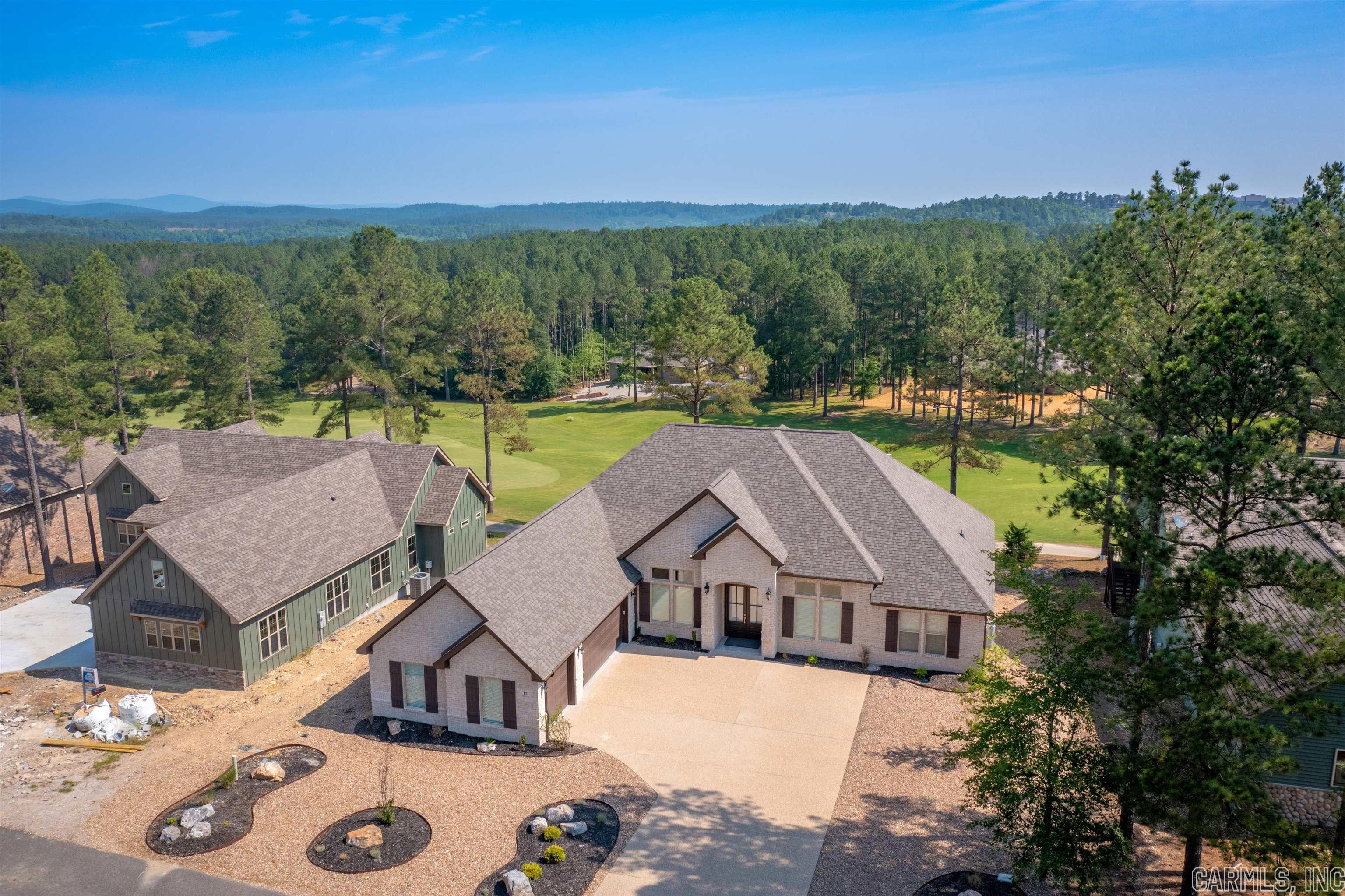 Fabulous view of Granada Golf Course #10 fairway from tee to green! Northern exposure in the back - shaded & nice viewing from covered patio. This 1-1/2 year old house is better than new (was used very little as a retreat) and has Hunter Douglas shades in already. Hardwood, granite, stainless appliances, volume ceilings, LOTS of windows, divided bedrooms, 2-1/2 baths, formal dining area, large breakfast area, walk-in pantry, gas log fireplace, walk up to attic storage, generous 3 car garage, low maintenance landscape , stone & brick exterior. Peaceful, quiet setting to enjoy relaxation or get out there & conquer Granada Golf Course. SEE AGENT REMARKS