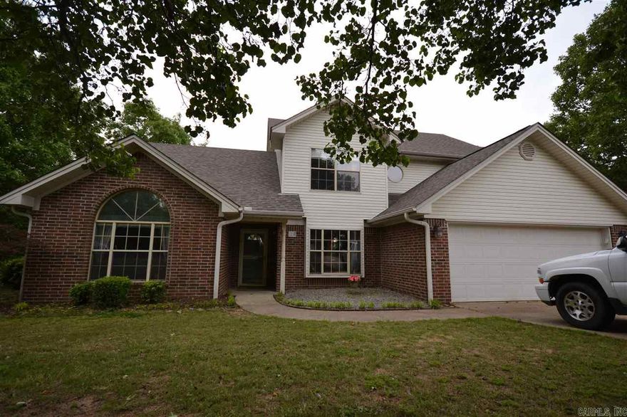 MOVE IN READY!!!!Space Galore in this Wonderful 5 bedroom/ 2.5 Bath Home!!! Beautiful Hardwood Laminates Throughout! Eat-in Kitchen w/ TONS of Cabinets & Bar, Separate Dining, Living Room w/Fireplace & Vaulted Ceiling! Master BR Main Level features His & Her Sinks, Jacuzzi Tub & Walk-n Shower! Guest Suite w/sitting area upstairs PLUS 3 Bedrooms & Bath! Large Tree-shaded Backyard w/HUGE 2-Tier Deck for Relaxing and Entertaining. 2-car Garage & Extra Parking for Boat or Camper.