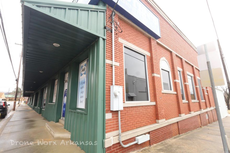 A corner lot, metal building in the busy Marshall town square.  There is plenty of traffic in the area with the county courthouse, MVD, Assessor's office, Clerk's office, Post Office, and more in walking distance.  This parcel is situated on the street level with a basement.  Both levels are heated and cooled. This would make a great retail store or restaurant having large windows on the Main Street and so close to many business and government offices.  With the heavily traveled Hwy 65 passing through Marshall, people come from all over to see the fall colored leaves, float the famous Buffalo National River, or head to Branson, MO. for dinners and shows.  Just about 45 minutes north or south you will find hospitals, a community college, shopping, and more.