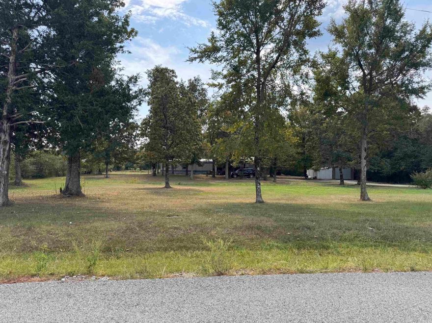 A country feel with pasture and wooded areas surrounding, this 5 acre lot has a home that sits back from the paved road. An added porch and extra room was built on to the original mobile home. The owners suite has a large connected bath with separate tub and shower. There is also shop building with a storm shelter. Lots of wildlife make this a great place for a hunting enthusiast, or room to have a small farm and livestock with a pond. See agent remarks for showing instructions.