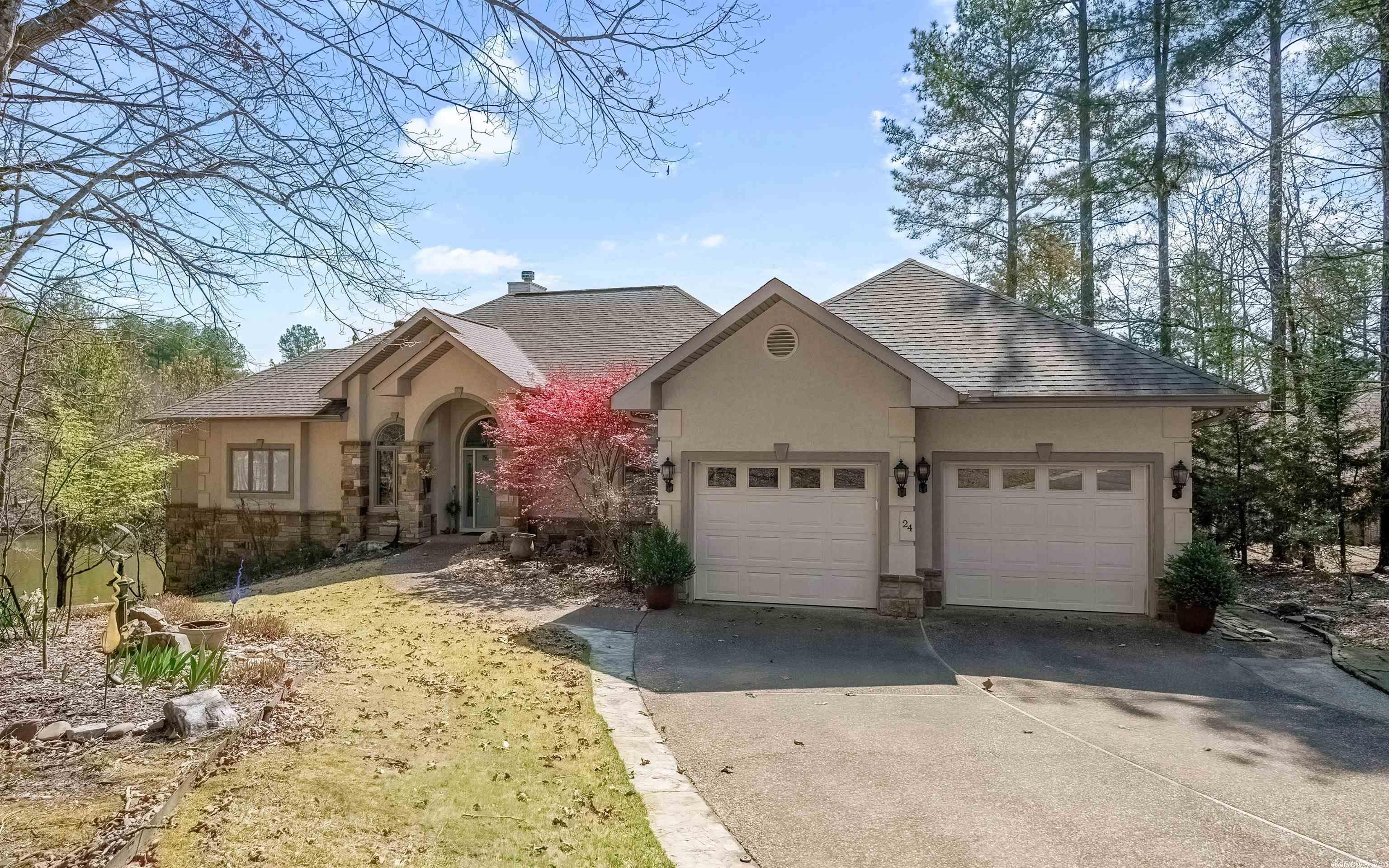 Lovely one of a kind custom home that welcomes you the minute you walk in. Large windows throughout bring in the breathtaking views of Lake Granada. Living room flows into your Dream Kitchen, eating area, sitting area, and a private deck for outdoor dining. Separate private formal dining off of the kitchen for that special holiday gathering. Large primary suite, gorgeous bath with soaking tub and walk in shower. Large sitting area with built-ins & a door out to the composite deck with open views of the water. Tuck your guests downstairs with 2 bedrooms, bath and a 2nd living area with doors leading out to a patio with a fabulous view! Heated and cooled workshop that could be a 4th bedroom. New dock and lift constructed in 2022. Plenty of storage in the walk-in crawl space. Hand scraped engineered floors throughout, new tiling in kitchen, primary bath, and downstairs. 2 car attached garage w/ 2 car detached golf cart and storage garage. This home has been loved and meticulously cared for so move right in and enjoy lake life and all the amenities HSV has to offer. ADJACENT LOT AVAILABLE FOR PURCHASE AGENTS SEE REMARKS