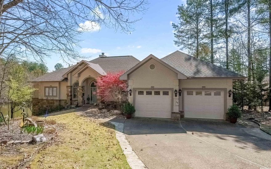 Lovely one of a kind custom home that welcomes you the minute you walk in. Large windows throughout bring in the breathtaking views of Lake Granada. Living room flows into your Dream Kitchen, eating area, sitting area, and a private deck for outdoor dining.  Separate private formal dining off of the kitchen for that special holiday gathering.  Large primary suite, gorgeous bath with soaking tub and walk in shower. Large sitting area with built-ins & a door out to the composite deck with open views of the water. Tuck your guests downstairs with 2 bedrooms, bath and a 2nd living area with doors leading out to a patio with a fabulous view! Heated and cooled workshop that could be a 4th bedroom.  New dock and lift constructed in 2022. Plenty of storage in the walk-in crawl space. Hand scraped engineered floors throughout, new tiling in kitchen, primary bath, and downstairs. 2 car attached garage w/ 2 car detached golf cart and storage garage.  This home has been loved and meticulously cared for so move right in and enjoy lake life and all the amenities HSV has to offer.   ADJACENT LOT AVAILABLE FOR PURCHASE AGENTS SEE REMARKS