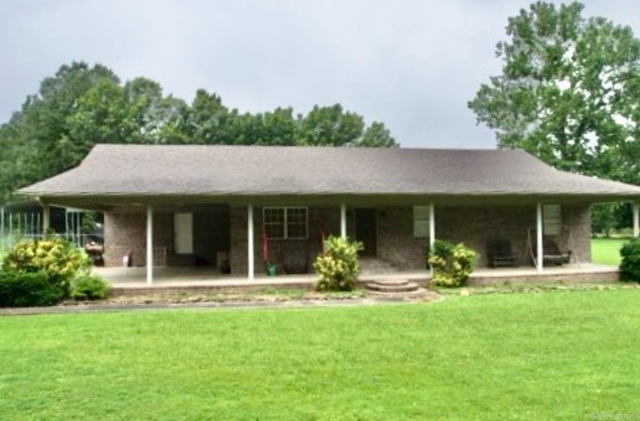 Welcome to your peaceful country retreat! I love this 2,270 sq ft brick home that is nestled on 1.64 acres, offering the perfect blend of tranquility and comfort. Step inside to an inviting open-concept living area where the living room, kitchen, and dining room flow seamlessly together—perfect for entertaining and everyday life. The home features 3 spacious bedrooms, each with a walk-in closet for ample storage. There are also 2 full bathrooms, a dedicated home office or a perfect hobby/craft room and an additional game room that can be adapted to your needs. A practical mudroom offers a perfect place to transition from the outdoors. The home's front porch spans the entire length of the house, providing a serene spot to enjoy your morning coffee while taking in the country air. The outdoor space is just as impressive. The backyard is fully fenced, creating a safe and private area for kids and pets to play. A two-car carport provides shelter for your vehicles, and a detached, portable RV carport offers a convenient solution for storing your recreational vehicle. This property is a fantastic opportunity for anyone seeking space, privacy, and a great family-entertaining layout.