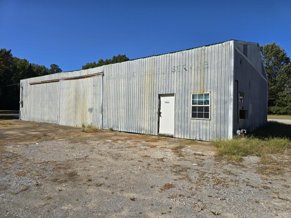 Commercial building with 2 drive-in doors. Previous uses include diesel engine repair shop and plumbing contractor.
