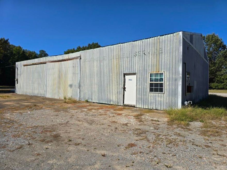 Commercial building with 2 drive-in doors. Previous uses include diesel engine repair shop and plumbing contractor.