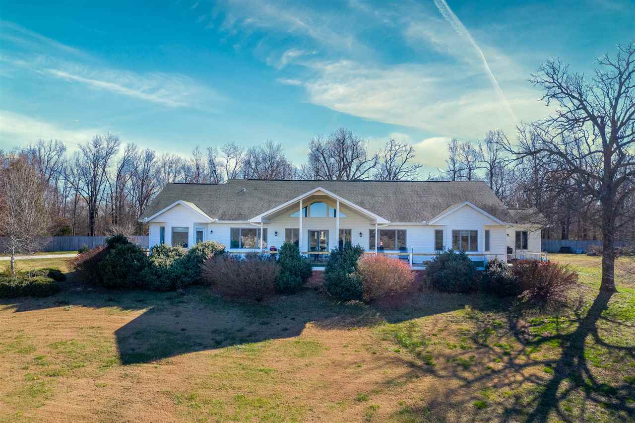 Phenomenal countryside views from KT, FR, deck, MBRM, 2nd BRM. Large foyer w/access to formal LR. Crown molding. Bamboo flooring. FR has vaulted ceilings, opens to a cov. deck. Completely renovated KT w/instant hot water, glass faced upper cabs, pull out shelving, glass tile backsplash, granite countertops, SS appliances, island. Breakfast nook w/bay window. MBRM has bay window, adjoining rm could be used as an office, exercise or TV room, nursery. Pasture, fenced, 2 ponds, hay & working cattle barn & more!