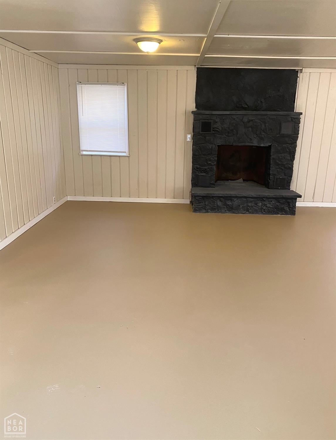 Charming mixed-use opportunity with high visibility on US Highway 63 just outside of Hardy, Arkansas. This 1,152 sq ft live/work space includes a bedroom, full bath, large office or display area, and an additional room that could serve as a second bedroom or workspace. Set on approximately 0.57 acres with 150 feet of highway frontage, the property offers ample parking and a peaceful creek at the rear. Ideal for a small business, antique shop, studio, or live-in office setup. A rustic wooden structure at the back is available separately and could be renovated for use as a guest space, trailer Airbnb, or creative project. This versatile space offers both function and charm in a serene setting with strong commercial potential.